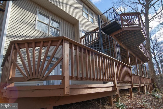 wooden deck featuring stairs