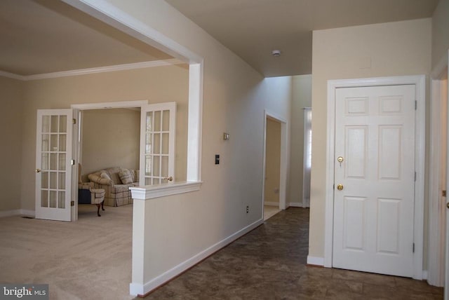 hall featuring french doors, ornamental molding, carpet flooring, and baseboards