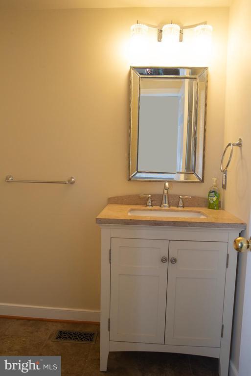 bathroom featuring vanity and baseboards