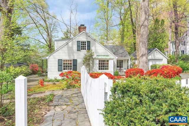 view of front of home featuring a chimney