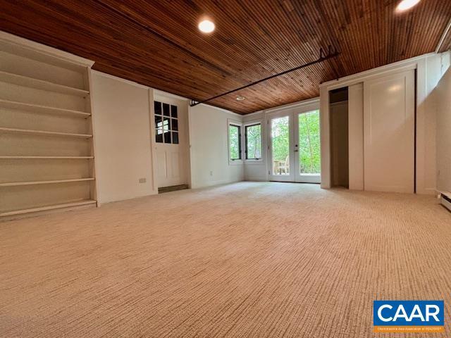 unfurnished living room featuring wooden ceiling, carpet flooring, and recessed lighting