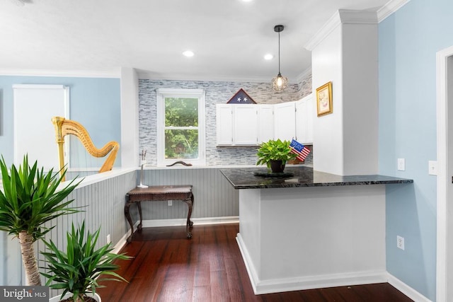 11428 Orange Plank Rd, Locust Grove, VA 22508 - kitchen with dark stone counters, dark wood-type flooring, ornamental molding, white cabinets, and decorative light fixtures