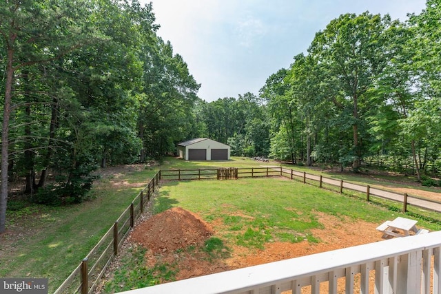 11428 Orange Plank Rd, Locust Grove, VA 22508 - view of yard featuring an outbuilding, a detached garage, and a wooded view