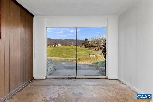 492 Avon Rd, Afton, VA 22920 - doorway to outside with baseboards, crown molding, wood walls, and concrete floors