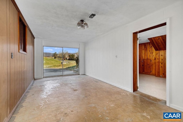 492 Avon Rd, Afton, VA 22920 - spare room with baseboards, wooden walls, visible vents, and concrete floors