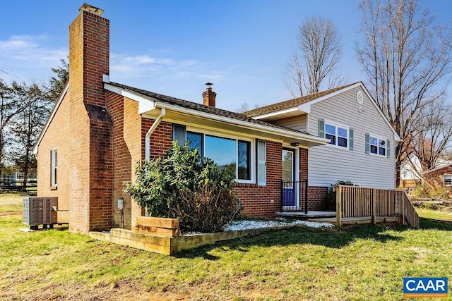 492 Avon Rd, Afton, VA 22920 - tri-level home with a chimney, central AC unit, brick siding, and a front lawn