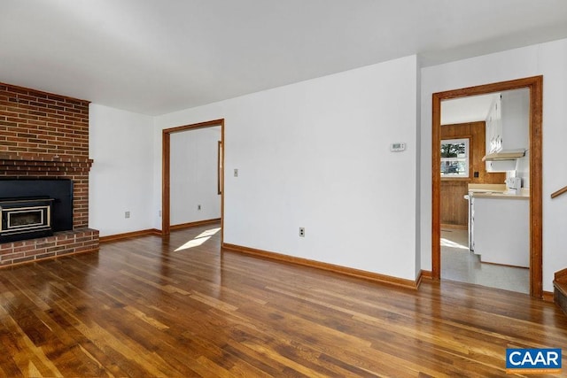 492 Avon Rd, Afton, VA 22920 - unfurnished living room with a fireplace, baseboards, and wood finished floors