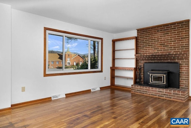 492 Avon Rd, Afton, VA 22920 - unfurnished living room with visible vents, wood finished floors, baseboards, and a fireplace