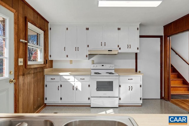 492 Avon Rd, Afton, VA 22920 - kitchen with under cabinet range hood, light countertops, white cabinets, and electric stove