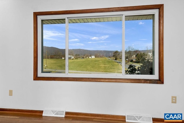 492 Avon Rd, Afton, VA 22920 - interior space featuring baseboards, a mountain view, visible vents, and wood finished floors