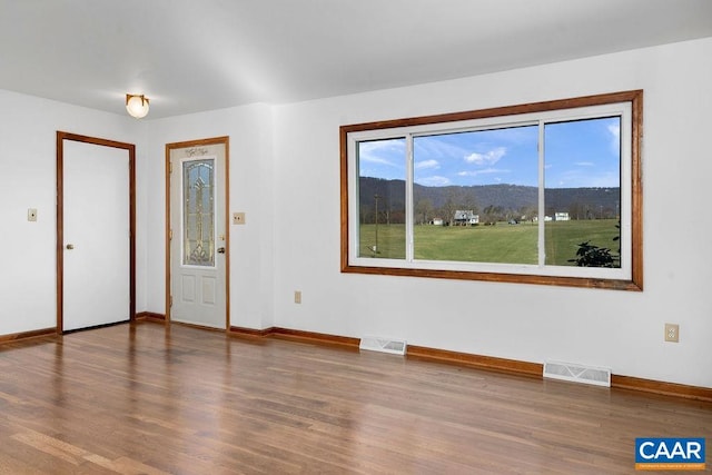 492 Avon Rd, Afton, VA 22920 - empty room featuring baseboards, wood finished floors, visible vents, and a mountain view