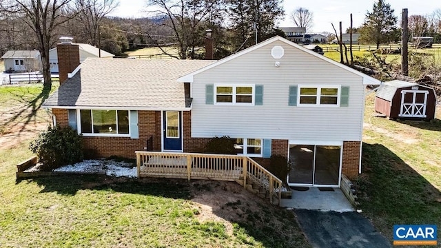 492 Avon Rd, Afton, VA 22920 - back of property featuring a yard, brick siding, and a storage unit