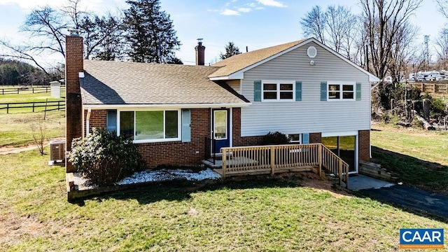 492 Avon Rd, Afton, VA 22920 - split level home with a front lawn and brick siding