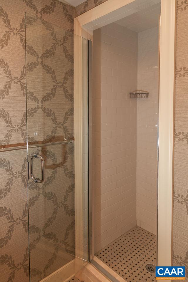 full bathroom with a shower stall