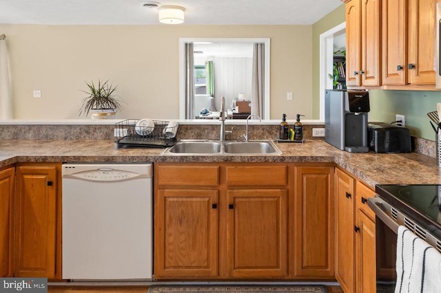 2266 Honeyville Rd, Stanley, VA 22851 - kitchen with dishwasher, a sink, and brown cabinets
