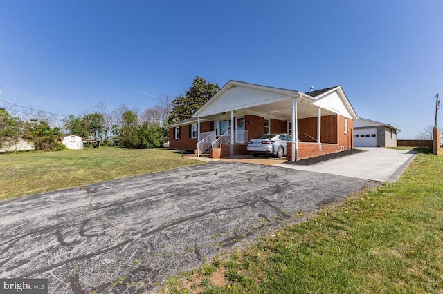 2266 Honeyville Rd, Stanley, VA 22851 - single story home with asphalt driveway, brick siding, a front lawn, a porch, and an attached garage