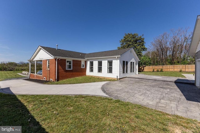 2266 Honeyville Rd, Stanley, VA 22851 - back of property with brick siding, concrete driveway, and a patio