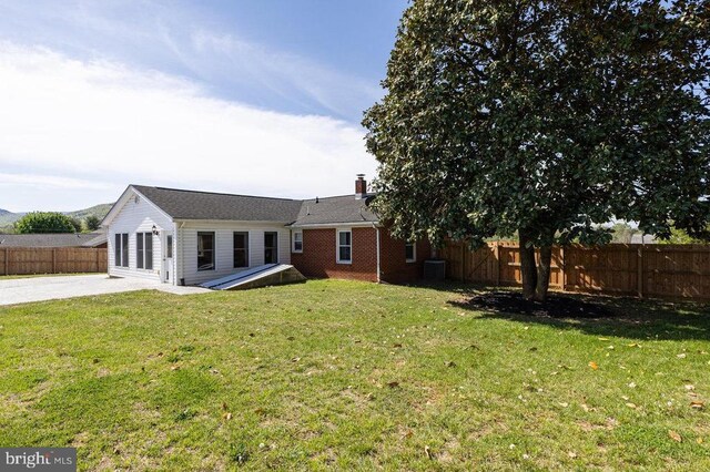 2266 Honeyville Rd, Stanley, VA 22851 - back of house featuring a patio area, a chimney, and brick siding