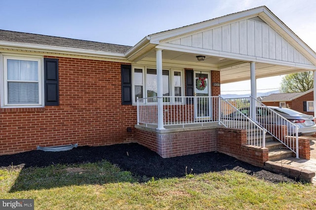 2266 Honeyville Rd, Stanley, VA 22851 - view of front facade featuring brick siding, covered porch, and roof with shingles
