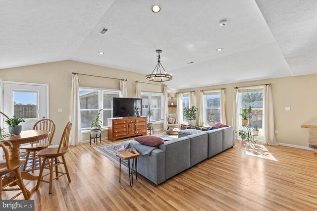 2266 Honeyville Rd, Stanley, VA 22851 - living room featuring light wood-type flooring, plenty of natural light, vaulted ceiling, baseboards, and recessed lighting