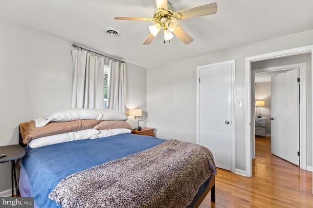 2266 Honeyville Rd, Stanley, VA 22851 - bedroom with light wood finished floors, a ceiling fan, and baseboards