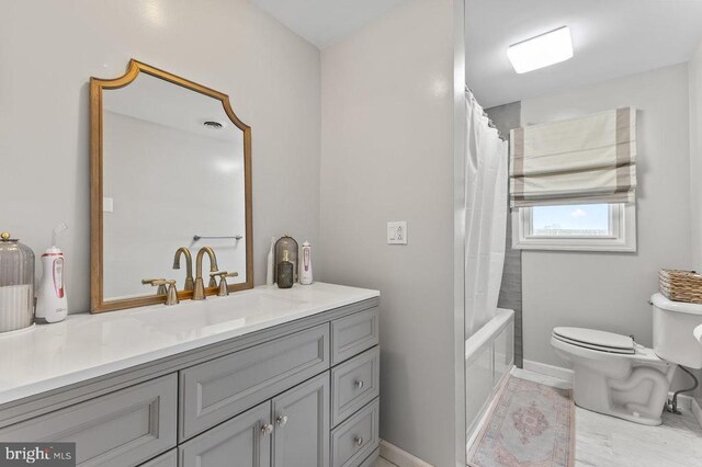 2266 Honeyville Rd, Stanley, VA 22851 - bathroom featuring toilet, vanity, shower / bath combo, and baseboards