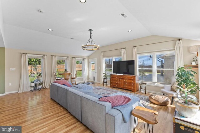 2266 Honeyville Rd, Stanley, VA 22851 - living room with lofted ceiling, light wood finished floors, baseboards, a chandelier, and recessed lighting