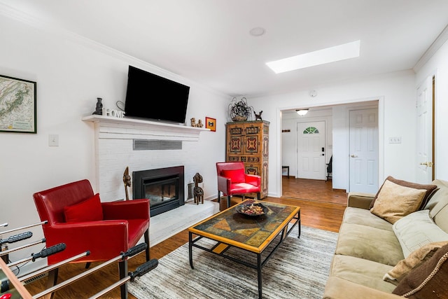 409 Cub Ln, Mcgaheysville, VA 22840 - living area with a skylight, wood finished floors, ornamental molding, and a fireplace