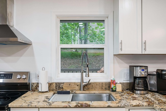 409 Cub Ln, Mcgaheysville, VA 22840 - kitchen with wall chimney range hood, stainless steel electric range oven, white cabinetry, and light stone counters