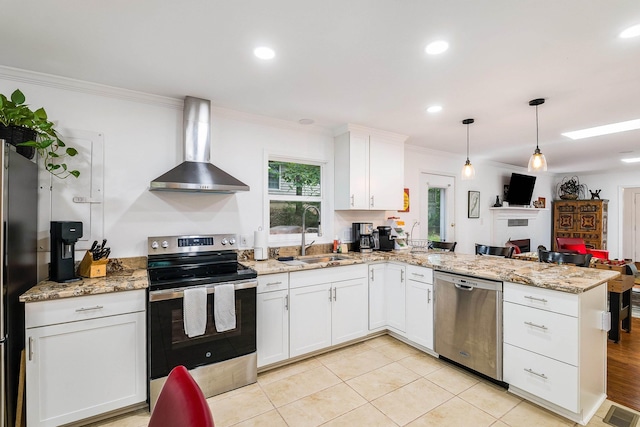 409 Cub Ln, Mcgaheysville, VA 22840 - kitchen featuring a peninsula, stainless steel appliances, ornamental molding, wall chimney range hood, and white cabinetry