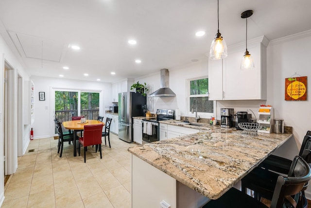 409 Cub Ln, Mcgaheysville, VA 22840 - kitchen with stainless steel appliances, wall chimney range hood, light stone counters, healthy amount of natural light, and recessed lighting