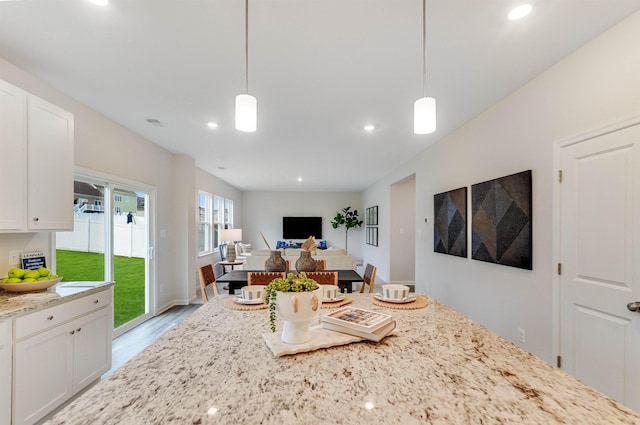 6 Windsong Ct N, Fishersville, VA 22939 - kitchen featuring light stone counters, white cabinetry, recessed lighting, hanging light fixtures, and wood finished floors