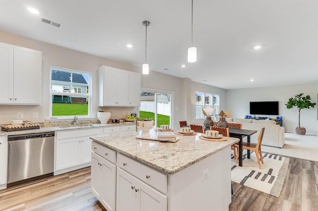 6 Windsong Ct N, Fishersville, VA 22939 - kitchen featuring dishwasher, light wood finished floors, a kitchen island, open floor plan, and white cabinetry