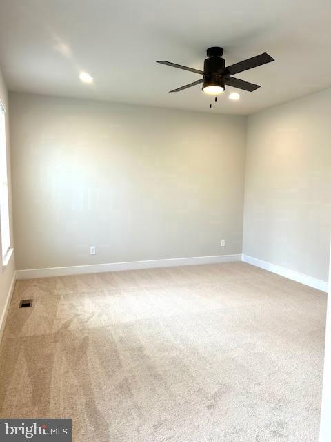 unfurnished room with ceiling fan, carpet floors, recessed lighting, and baseboards