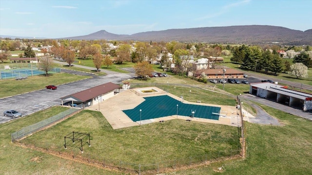 birds eye view of property featuring a mountain view