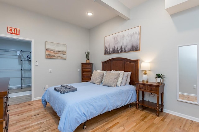 442 First St, Shenandoah, VA 22849 - bedroom with light wood finished floors, beamed ceiling, a walk in closet, baseboards, and recessed lighting