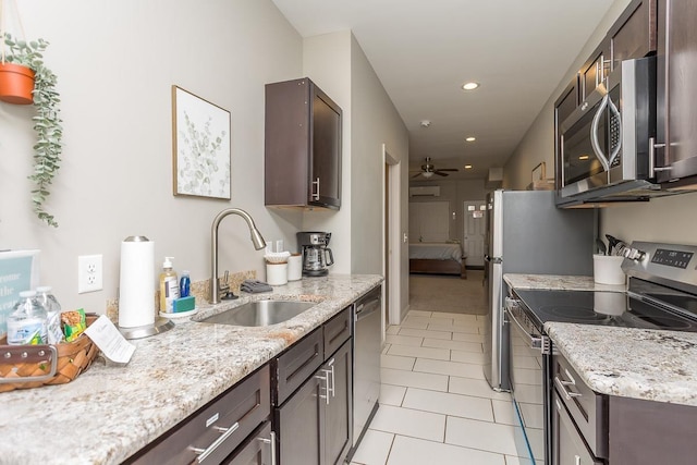 442 First St, Shenandoah, VA 22849 - kitchen featuring appliances with stainless steel finishes, dark brown cabinetry, light tile patterned floors, a sink, and recessed lighting