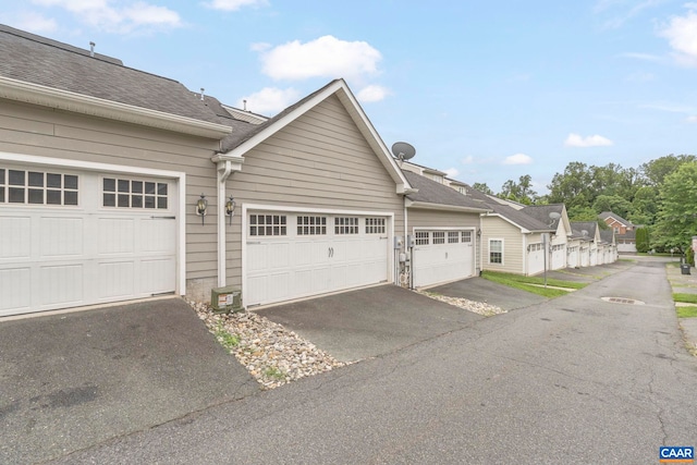 921 Bing Ln, Charlottesville, VA 22903 - view of side of property featuring roof with shingles