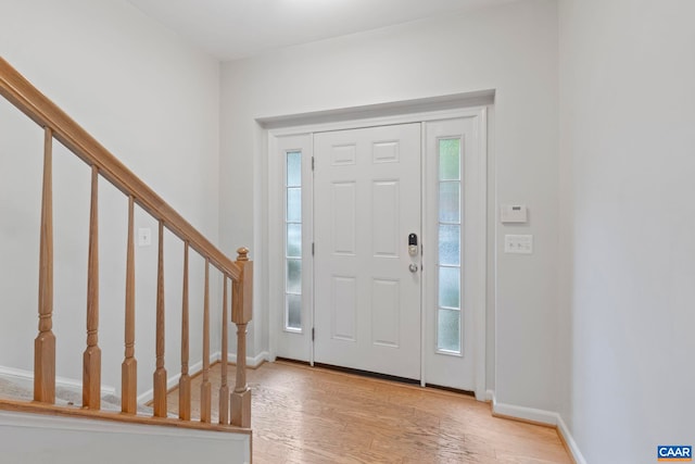 921 Bing Ln, Charlottesville, VA 22903 - entryway with light wood-style flooring and stairway