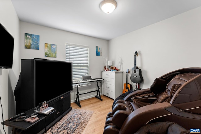 bedroom featuring light wood-style flooring