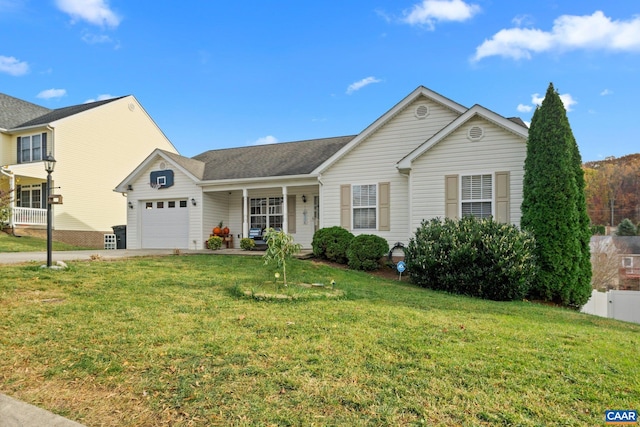 view of front facade with covered porch, a garage, a front lawn, and driveway