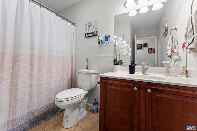 full bath featuring vanity, toilet, and tile patterned floors