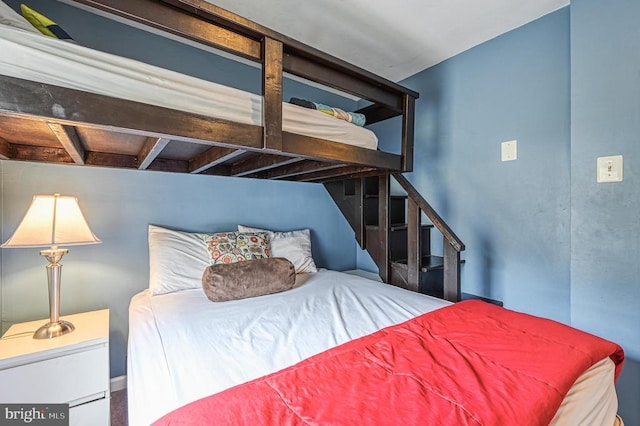 bedroom featuring beam ceiling