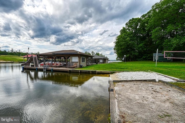 dock with a water view and a lawn