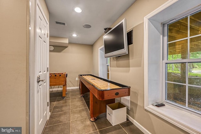 playroom featuring baseboards, dark tile patterned floors, and recessed lighting