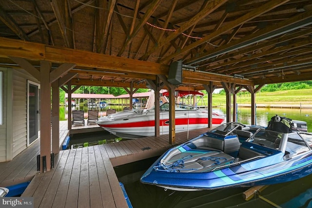 dock area featuring a water view and boat lift