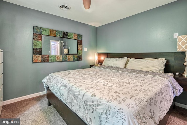 carpeted bedroom featuring baseboards and ceiling fan