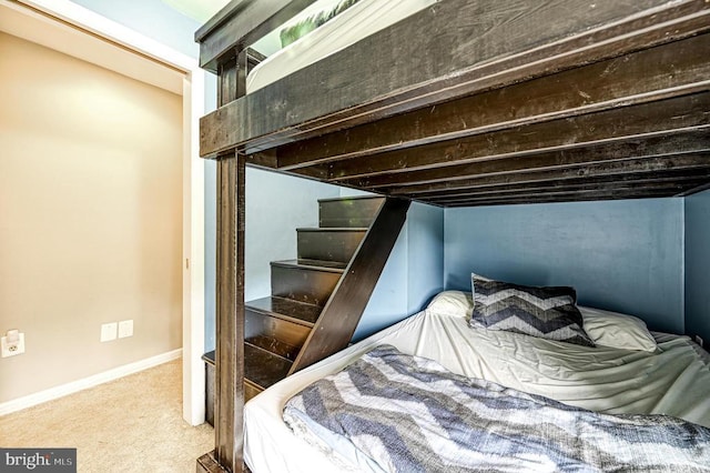 carpeted bedroom with baseboards