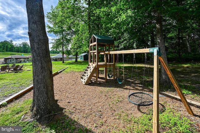 community jungle gym with a lawn