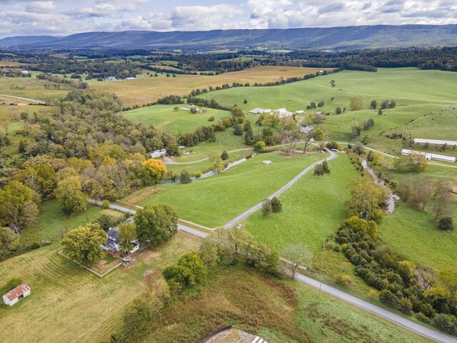 bird's eye view featuring a rural view and a mountain view